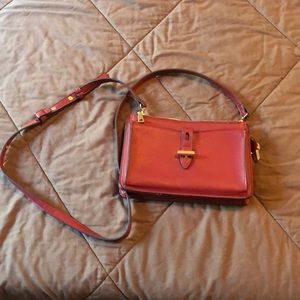 Purse with removeable pouch.